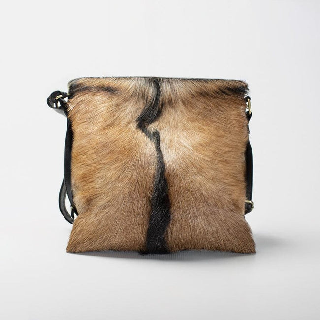 Sumi in Cheetah hide hair leather bag. Avaialble in solid tan, brown, black  & reversible suede! - Picture of Miow Shoes & Bags, Kerobokan - Tripadvisor